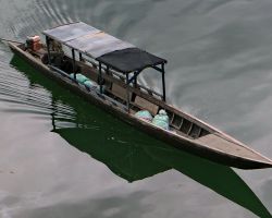 Closer view of the boat arriving at the old french colonial port, Ban Hang Khone. Don Khone, Laos.