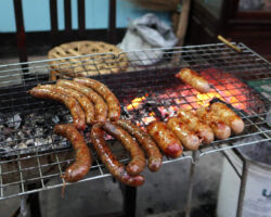 Local mild and spicy sausage on the BBQ. Both were good. A link was just over $.50 US each. Luang Prabang, Laos.