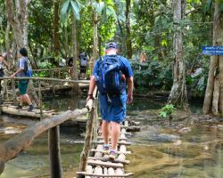 Rick crossing one of the bamboo walkways at the top of the Kuang Si waterfall. Luang Prabang, Laos.
