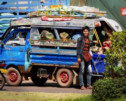 Mini truck filled with people and goods. Pakse, Laos.