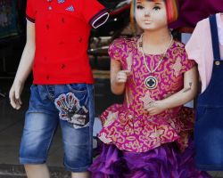 Clothing on display. They don't waste anything. Notice the one armed mannequin. Pakse, Laos.