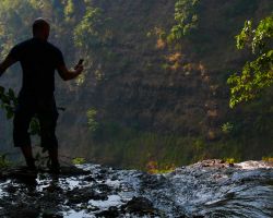 German hiking buddy at the edge of the Tad Fane Waterfall. This waterfall drops 394 ft (120 m). Pakse, Laos.