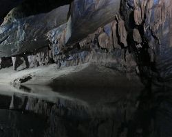 River inside Phong Nha cave. Phong Nha, Vietnam.
