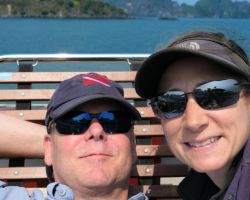 Rick and Alisa enjoying the sun on the upper deck during our boat cruise. Cat Ba Island, Vietnam.