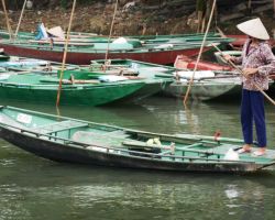 Local boat operator. Tam Coc, Vietnam.