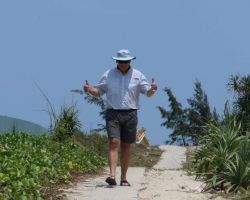 Rick giving the thumbs up this path leading to our beach destination for the day. Hoi An, Vietnam.