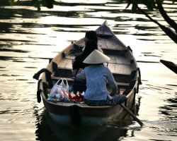 Local boat with tourists going for an evening ride. Hoi An, Vietnam.