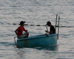 Motorized boat resembling a plastic kiddie pool or round plastic bath tub. Phu Quoc, Vietnam.