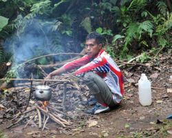 Chandu, our lead guide, cooking rice and fresh veggies for our lunch at Pos 2 on day 1. Mt Tambora, Indonesia (Sumbawa).