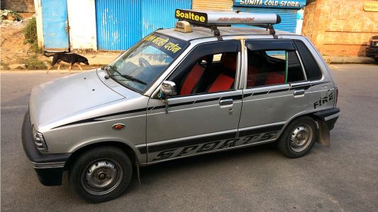 Typical Nepali taxi cab. Surprisingly, the driver plus four adults all with backpacks fit in this ride. Mardi Himal Trek D7, Nepal.