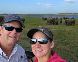 Rick and Alisa on a jeep safari with many wild Asian elephants nearby. Kaudulla National Park, Sri Lanka.