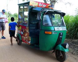 Tuk Tuk bakery wagon. They blast music as they drive around to alert people who might be interested in buying their goods. Sigiriya, Sri Lanka.