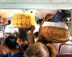 The train vendors on the crowded train...they simply push their way through. Galle Fort, Sri Lanka.