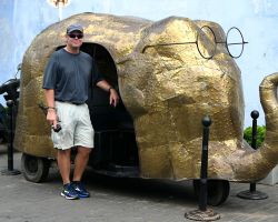 Rick standing in front of a fancy elephant shaped Tuk Tuk. Galle Fort, Sri Lanka.