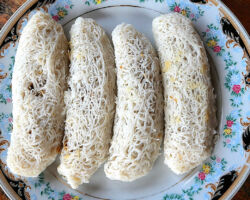 Local Sri Lankan string pancakes. These look really strange, but are very good. Coconut and sugar filling wrapped with noodles. Polonnaruwa, Sri Lanka.