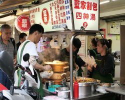 Street cart making delicious Gua Baos (bbq pork on steam buns). Greater Taipei, Taiwan.