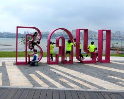 Kids playing on the Bali sign. Greater Taipei, Taiwan.