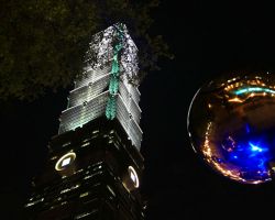 Street level view of Taipei 101 at night. Greater Taipei, Taiwan.