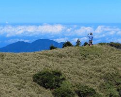 Rick taking video from a small ridgeline spur trail at the Mt Cilai South Peak (3,358 meters or 11,017 ft). Western Area, Taiwan.