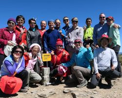 Group shot at the Mt Cilai South Peak (3,358 meters or 11,017 ft). Western Area, Taiwan.