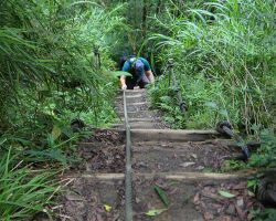 Rick climbing the last section of the steep ladders. Northern Area, Taiwan.