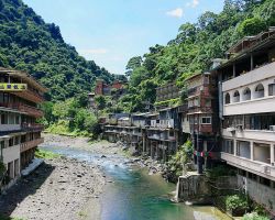 View looking upstream from the bridge. There were many natural hot springs steaming along the rivers edge. Northern Area, Taiwan.