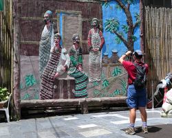 Rick shooting video of a mural outside the local museum. Northern Area, Taiwan.