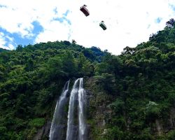 Cable cars taking tourists to the resort above the falls. Northern Area, Taiwan.
